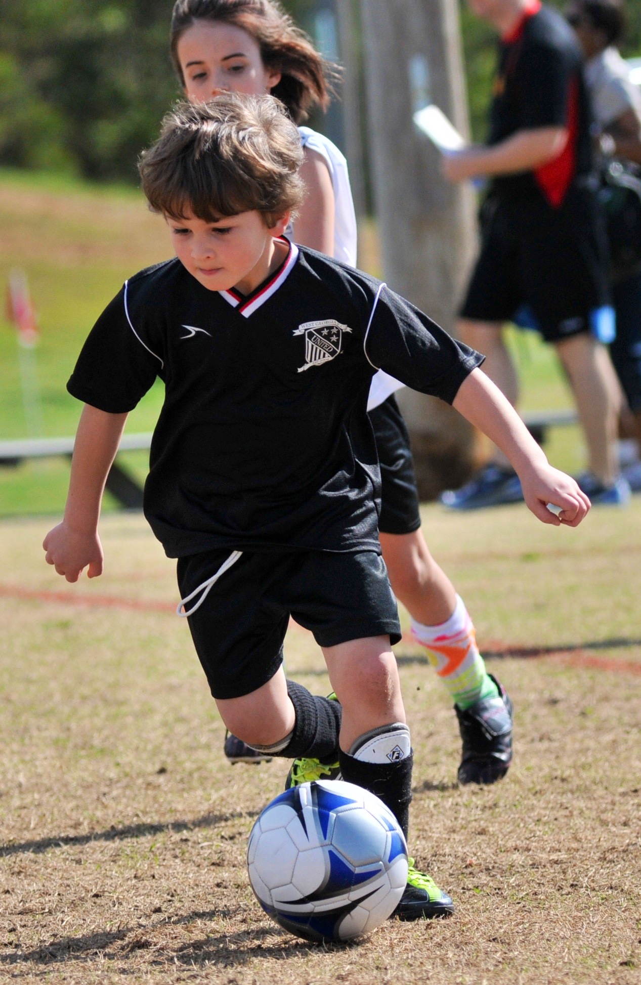 Young player dribbling during a Stepe Soccer Academy youth camp